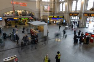 Business travelers walking in a train station.