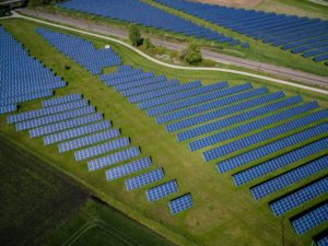 A solutions overview of solar panels in a field.