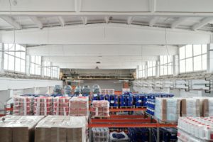 A large warehouse filled with pallets, offering supplier incentives.